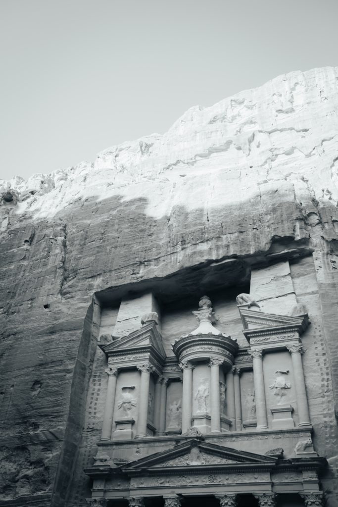 Greyscale shot of the historic Petra Wadi in Jordan